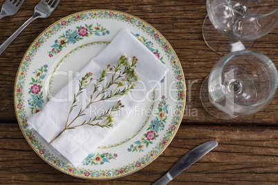 Flower with napkin on a plate