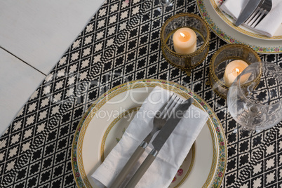 Elegance table setting with wine glasses on placemat