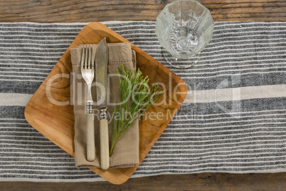 Flora and cutlery arranged on plate