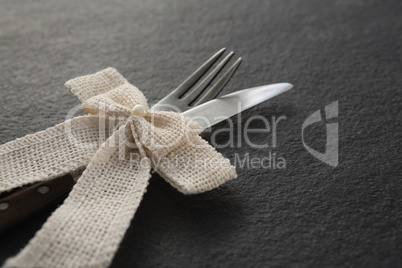 Fork and knife tied with a ribbon