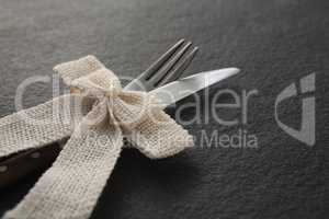 Fork and knife tied with a ribbon