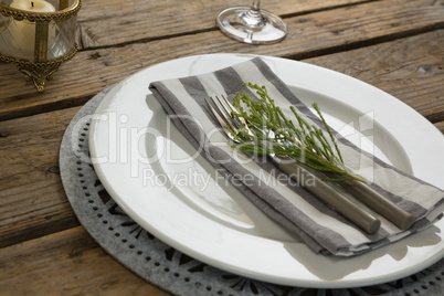 Elegance table setting on wooden plank