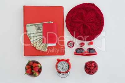Female accessories, fruits, currency and bunch of flower on white background