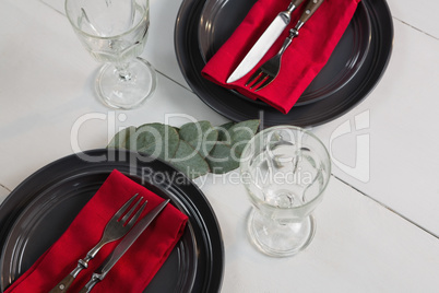 Elegance table setting on wooden plank