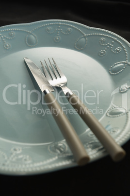 Plate and cutlery set on a table
