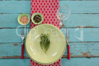 Table setting on wooden plank