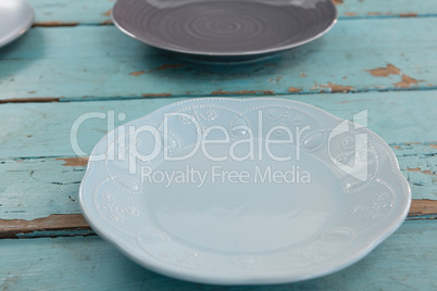 Empty plates on wooden table