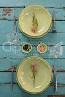 Table setting on wooden plank