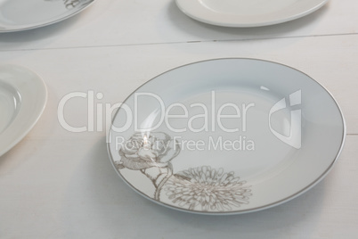 Empty plates on white background