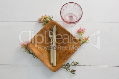 Elegance table setting on wooden plank