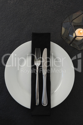 Table setting with lit candle