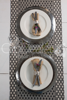 Elegance table setting with wine glasses on placemat
