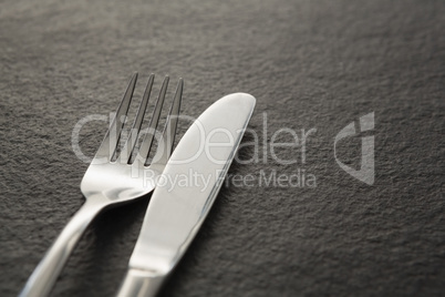 Fork and knife on black background