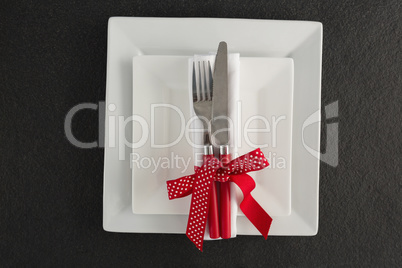 Table setting with square plates and cutlery