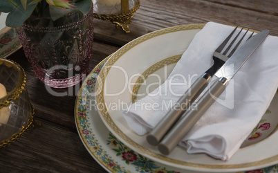 Elegance table setting on wooden plank