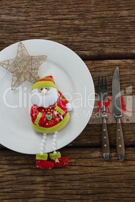 Santa claus with christmas ornament and cutlery
