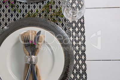 Elegance table setting on wooden plank