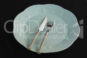 Plate and cutlery set on a table