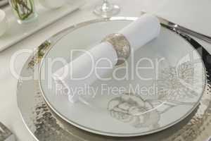 Plate and cutlery set elegantly on a table