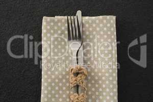 Fork and knife on a dotted napkin