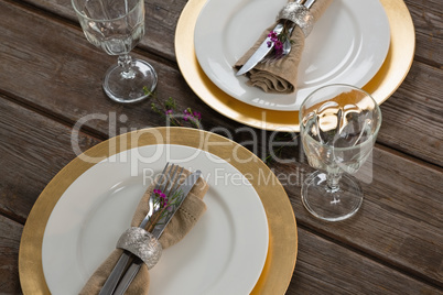 Elegance table setting on wooden plank