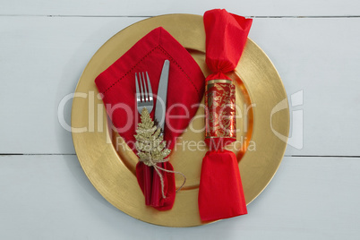 Chocolate and cutlery with napkin tied up with a rope