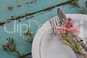 Cutlery with flower in a plate