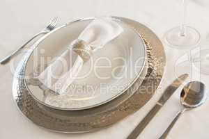 Plate and cutlery set elegantly on a table