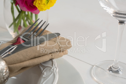 Elegance table setting on wooden plank