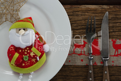 Santa claus with christmas ornament and cutlery