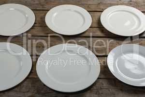 Empty plates arranged in row