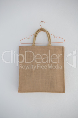 Close-up of jute bag hanging on wall