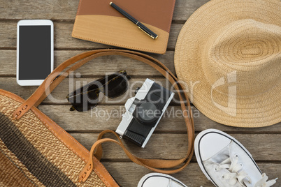 Travel accessories on wooden plank