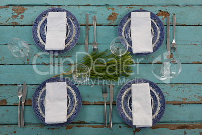 Table setting on weathered wooden plank