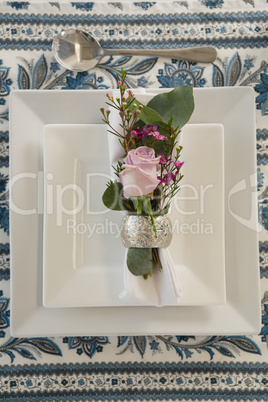 Plate and cutlery set elegantly on a table