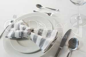 Plate and cutlery set on a table