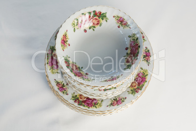 Plates and bowl with floral design set elegantly on a table