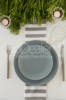 Plate and cutlery set elegantly on a table