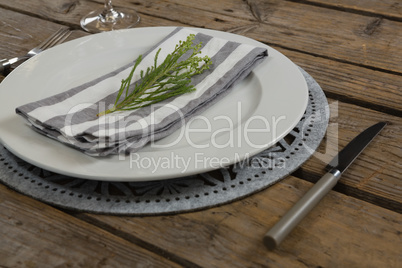 Elegance table setting on wooden plank