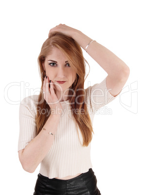 Woman holding her hands on head and face