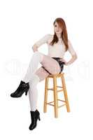 Beautiful woman sitting in shorts an heels
