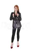Woman standing in black leather jacket