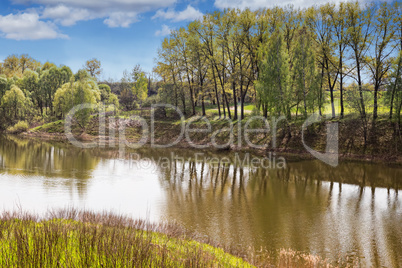 Large beautiful lake, with banks overgrown with forest.