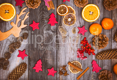 Christmas wooden background with cones and toys