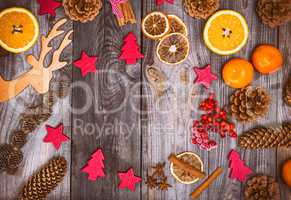 Christmas wooden background with cones and toys