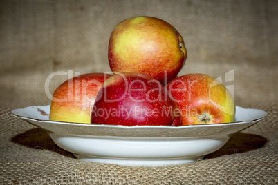 Apples on fruit plate with background