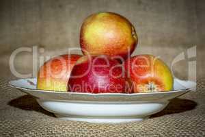 Apples on fruit plate with background