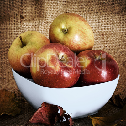 Apples on fruit plate with background