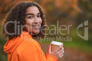Mixed Race Female Teenager Woman Drinking Coffee in Fall Autumn
