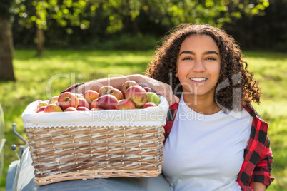 Mixed Race Female Teenager Leaning on Tractor Picking Apples